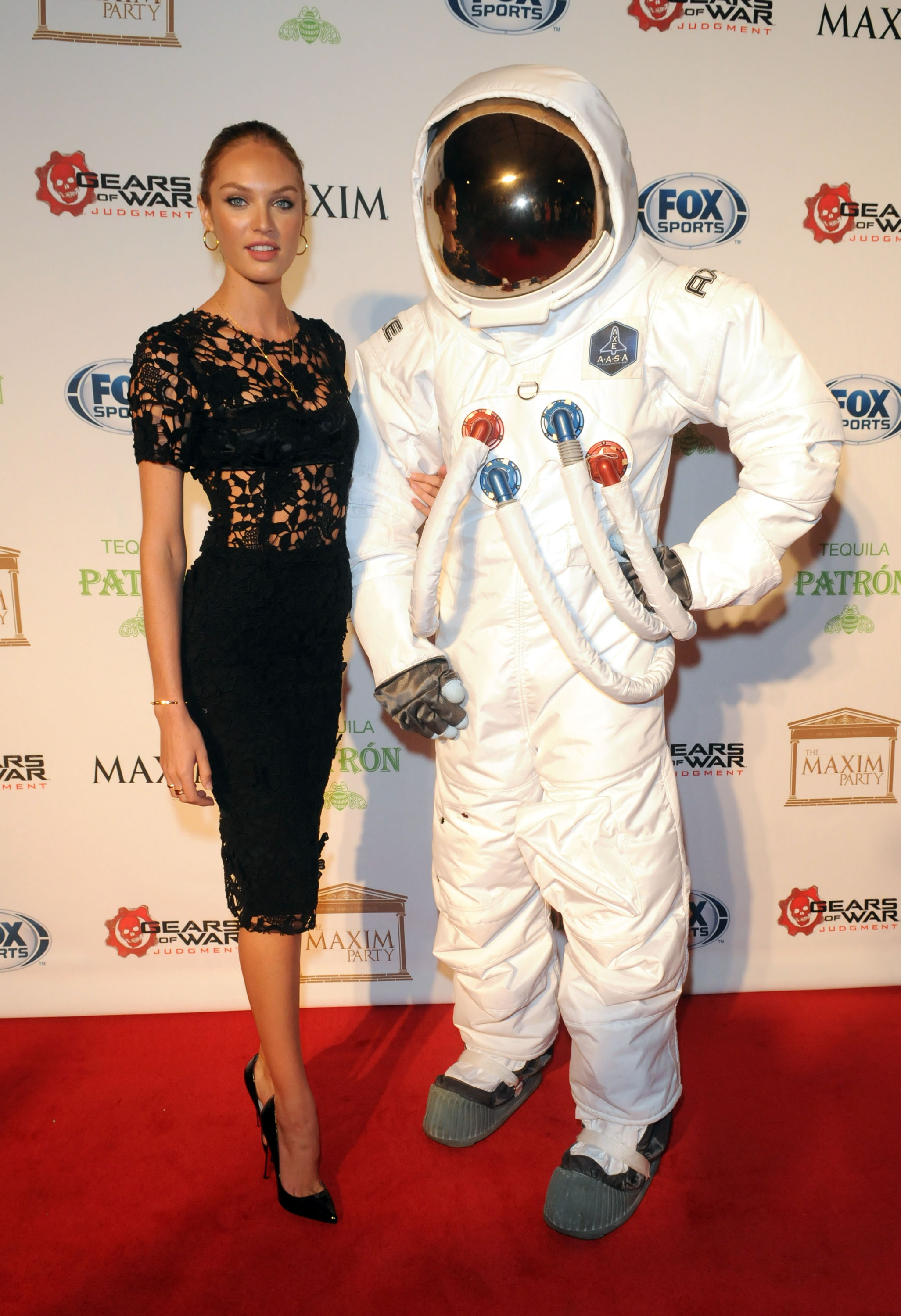 NEW ORLEANS, LA - FEBRUARY 02:  Model Candice Swanepoel and the AXE Astronaut attend The Maxim Party With "Gears of War: Judgment" For XBOX 360, FOX Sports & Starter Presented by Patron Tequila at Second Line Warehouse on February 1, 2013 in New Orleans, Louisiana.  (Photo by Gerardo Mora/Getty Images for Maxim)