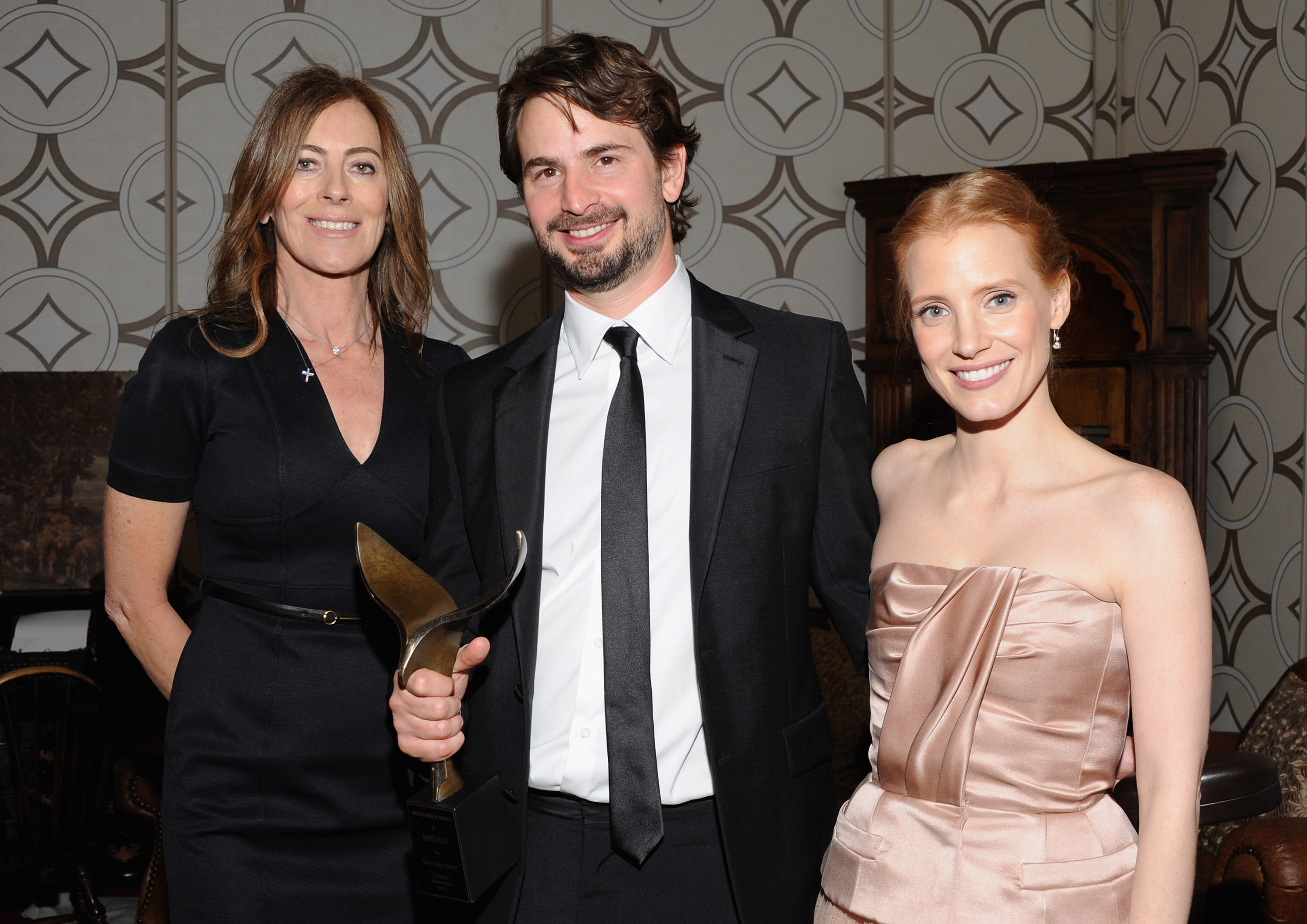 LOS ANGELES, CA - FEBRUARY 17:  Director Kathryn Bigelow, writer Mark Boal and actress Jessica Chastain in the 2013 Writers Guild Awards Backstage Creations Celebrity Retreat on February 17, 2013 in Los Angeles, California.  (Photo by Mark Sullivan/WireImage)