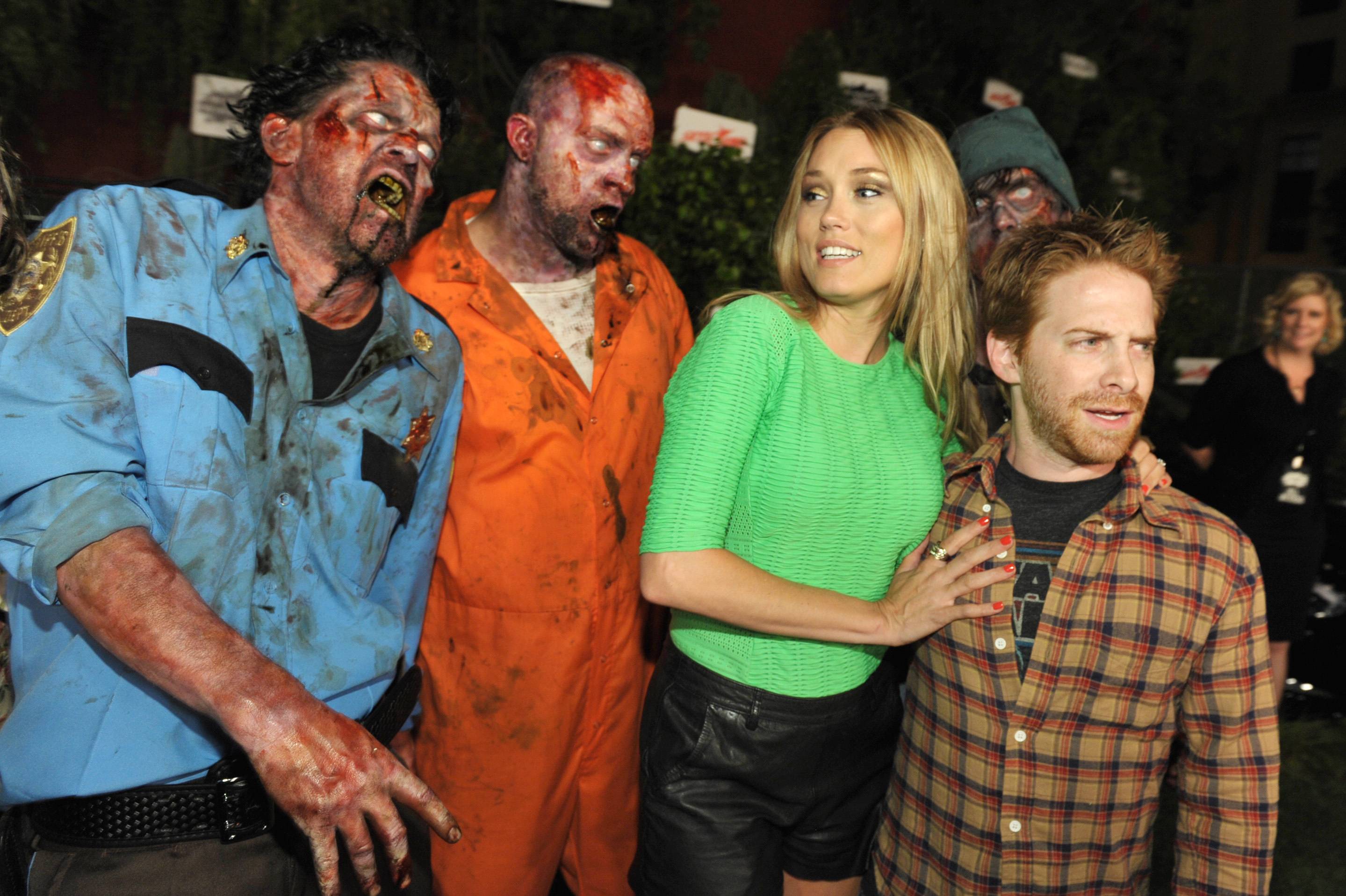 From right, Seth Green, Clare Grant and walkers attend Hyundai and Skybound's 'The Walking Dead' 10th Anniversary Celebration Event, on Friday, July 19, 2013 in San Diego, Calif. (Photo by John Shearer/Invision for Full Picture/AP Images)