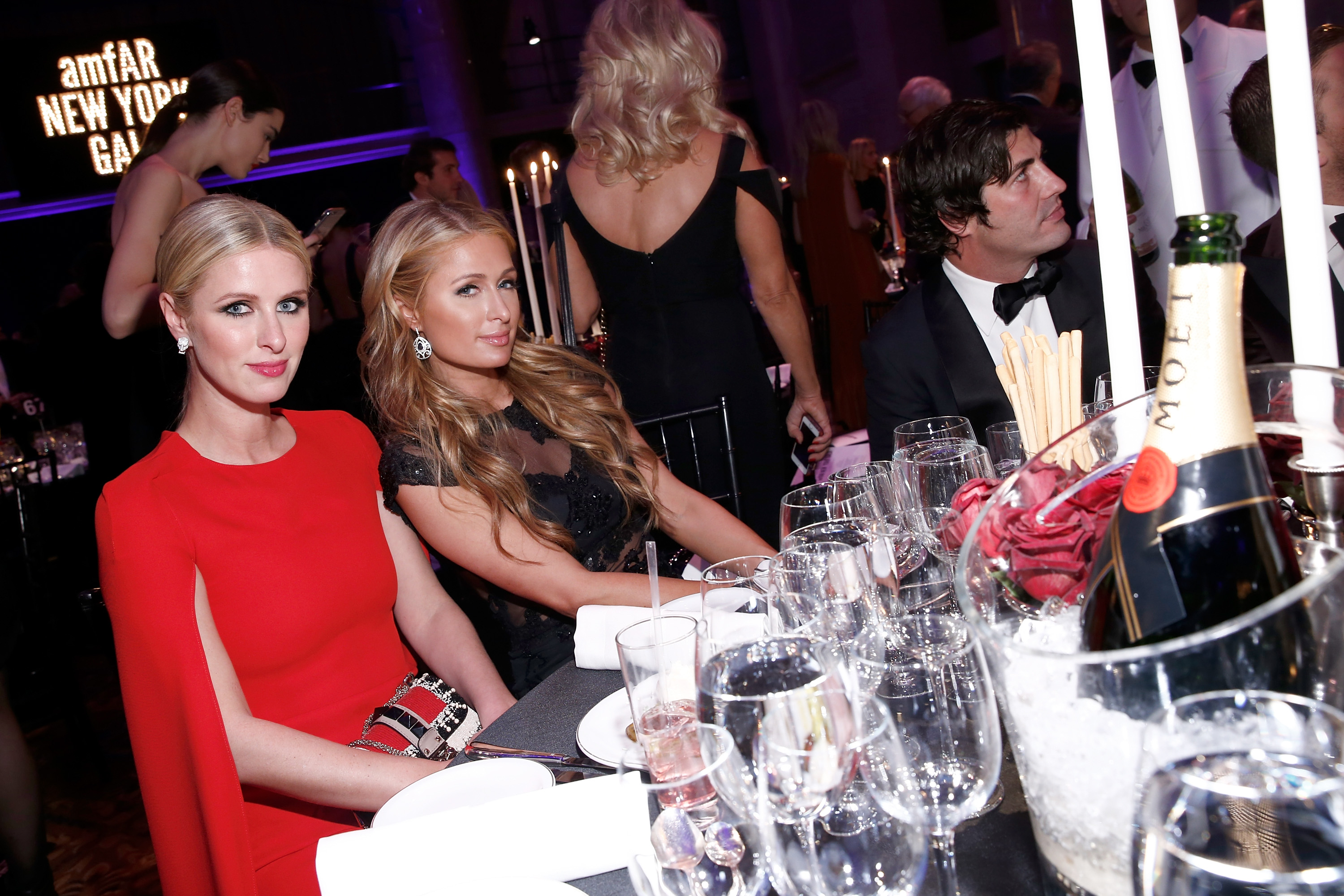 Nicky Hilton (L) and Paris Hilton attend the Moet & Chandon toast to the amfAR Gala at Cipriani Wall Street