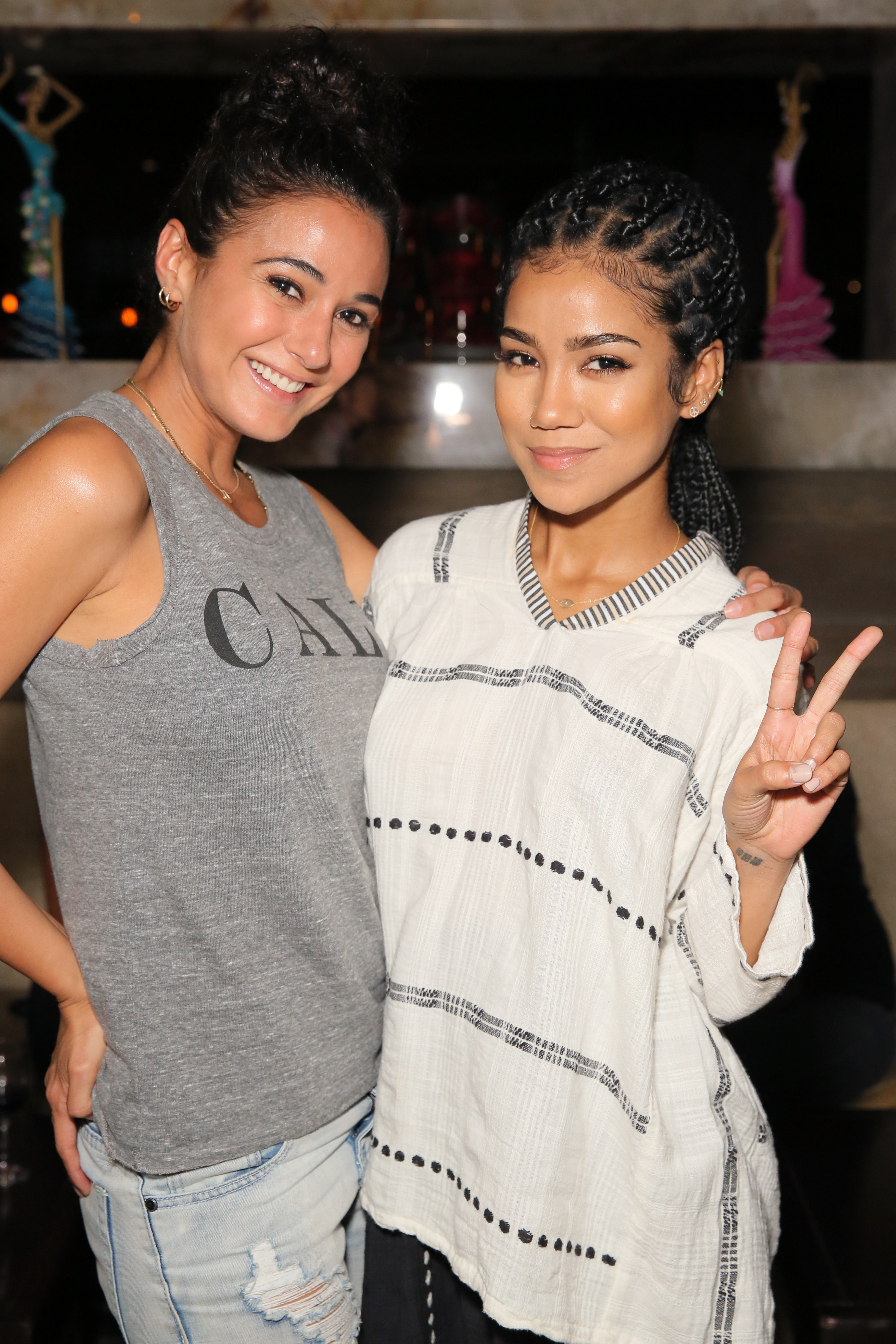 Actress Emmanuelle Chriqui (L) and singer Jhene Aiko attend EDL's grand opening party for Toca Madera