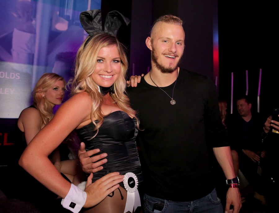 SAN DIEGO, CA - JULY 10:  Miss February 2007 Carly Lauren (L) and actor Alexander Ludwig attend Playboy and Gramercy Pictures' Self/less party during Comic-Con weekend at Parq Restaurant & Nightclub on July 10, 2015 in San Diego, California.  (Photo by Chelsea Lauren/Getty Images for Playboy)