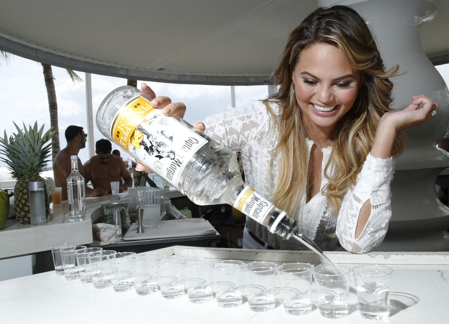 Captain Morgan and Chrissy Teigen at the Captain Morgan Sun Day Fun Day party Sunday, Aug. 9, 2015, in Miami. (Photo by Jack Dempsey)
