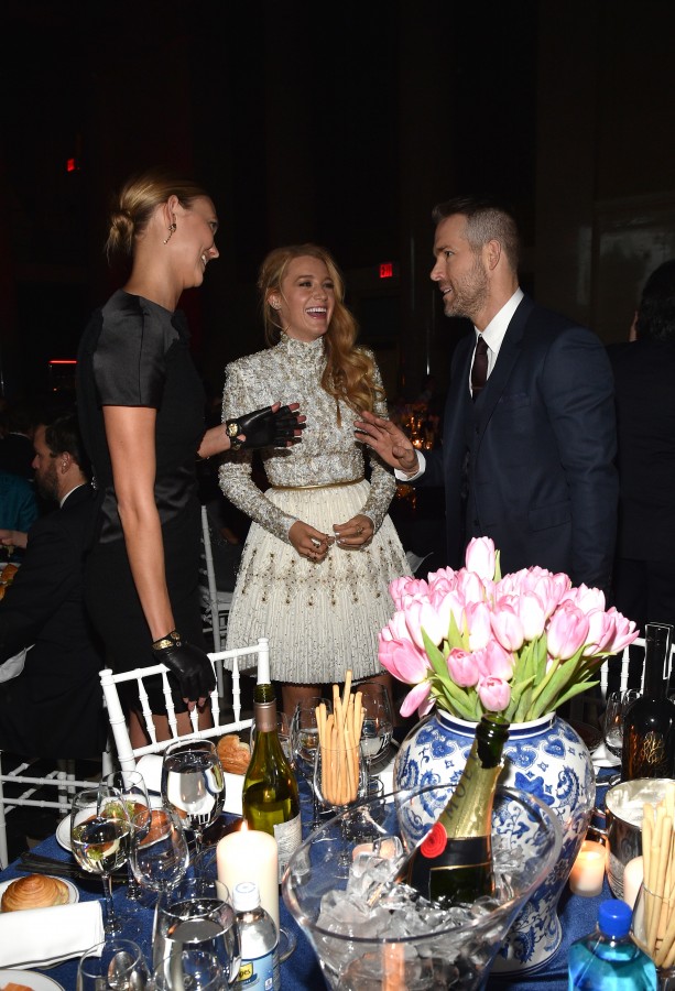 NEW YORK, NY - FEBRUARY 10: (L-R) Model Karlie Kloss and actors Blake Lively and Ryan Reynolds converse during Moet & Chandon Toasts to the amfAR Gala at Cipriani Wall Street on February 10, 2016 in New York City. (Photo by Bryan Bedder/Getty Images for Moet & Chandon)