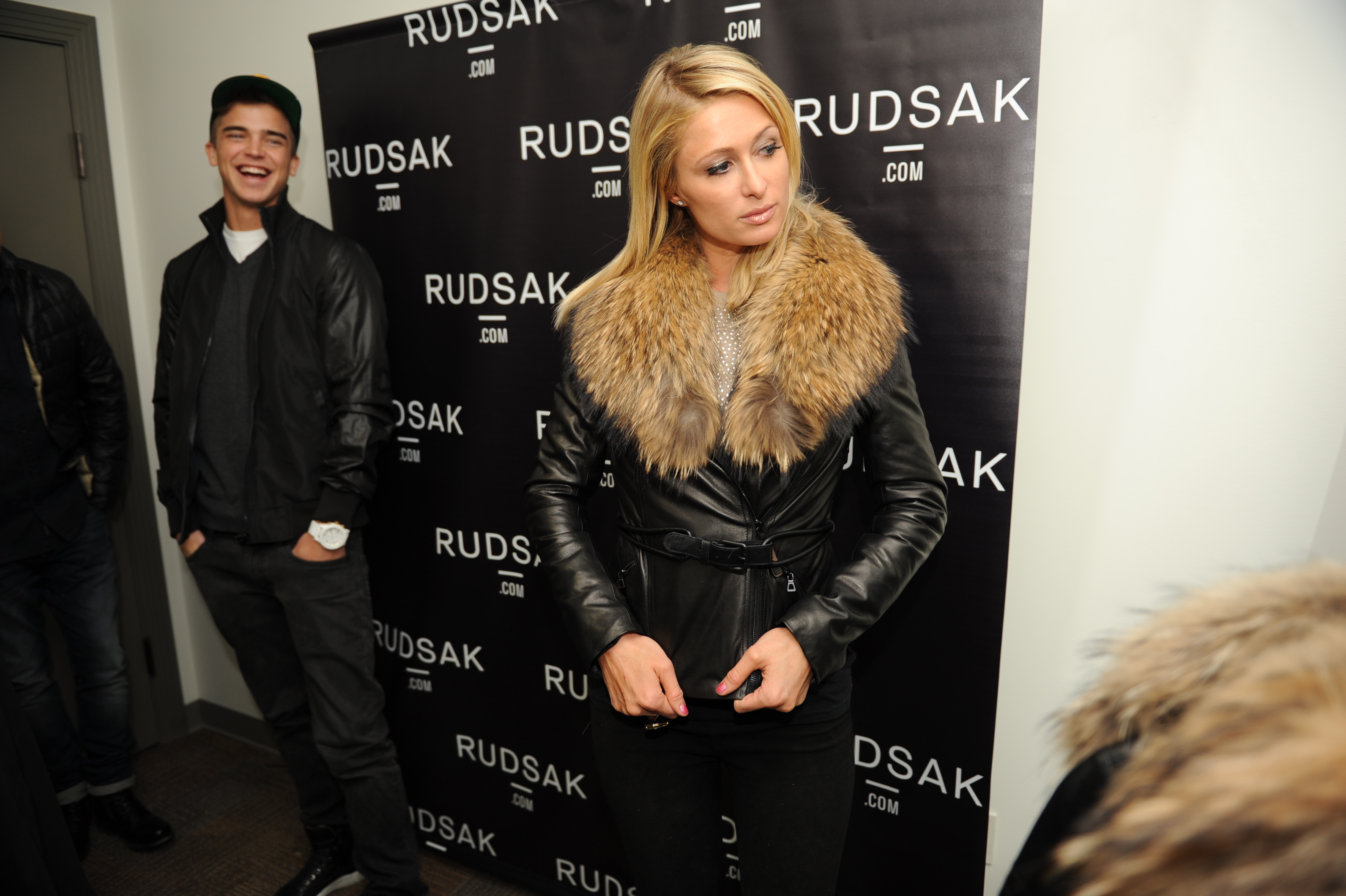 Paris Hilton trying on Rudsak jacket with River Viiperi at Miami Lounge at Sundance