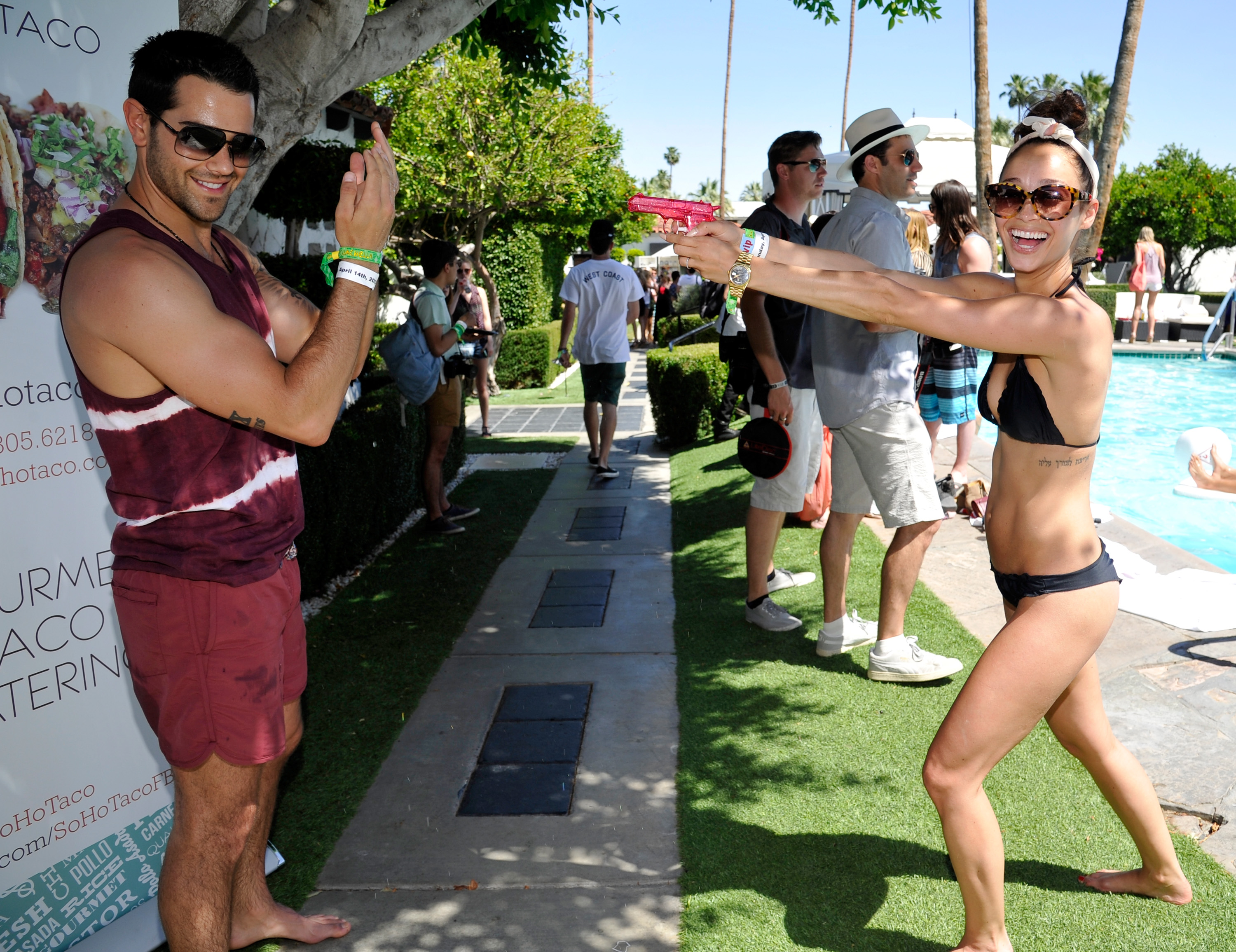PALM SPRINGS, CA - APRIL 14: Cara Santana and Jesse Metcalfe attend the GUESS Hotel pool party at the Viceroy Palm Springs on April 14, 2013 in Palm Springs, California. (Photo by John Sciulli/Getty Images for GUESS)