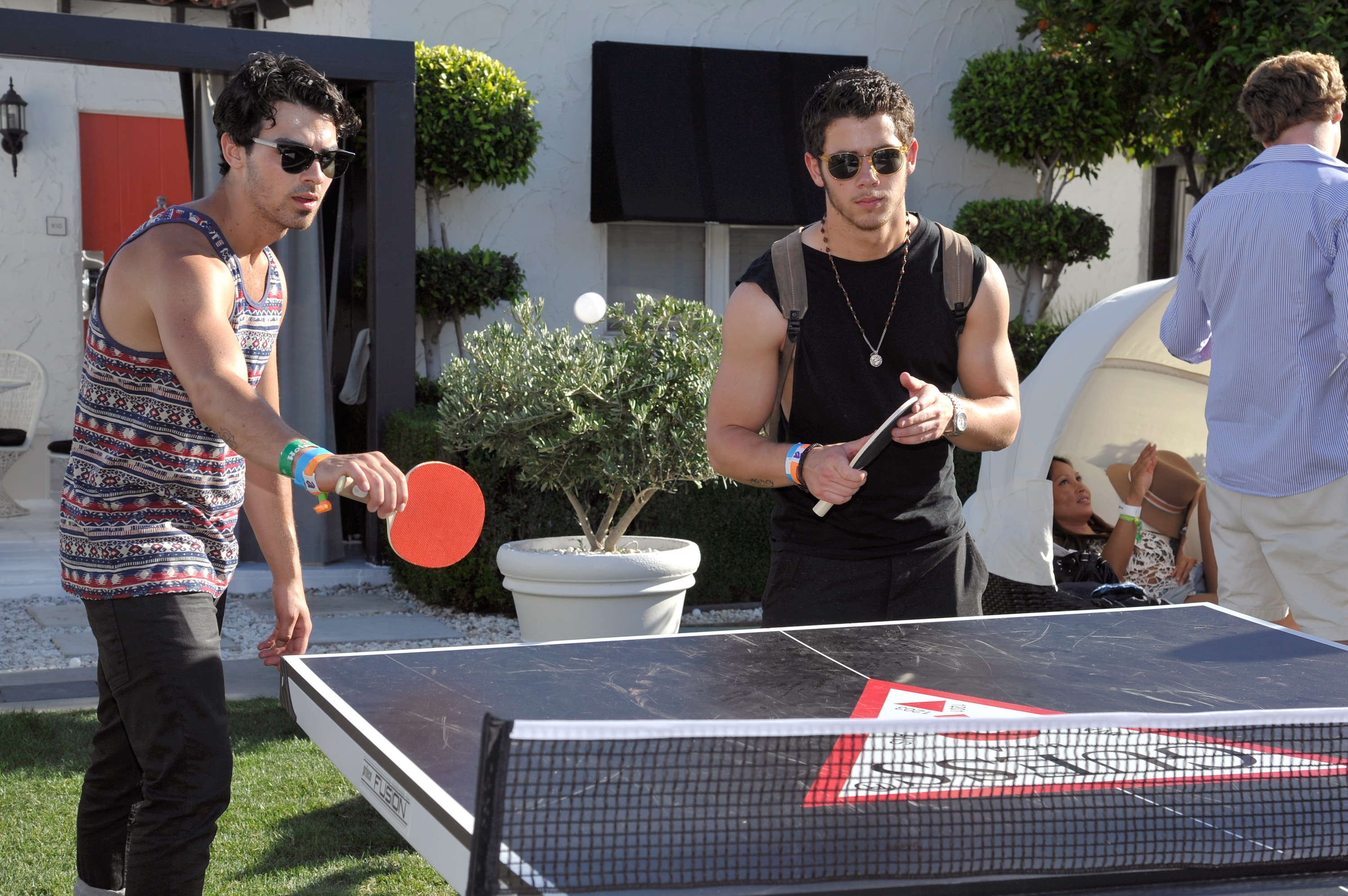 PALM SPRINGS, CA - APRIL 14: Joe Jonas and Nick Jonas attend the GUESS Hotel pool party at the Viceroy Palm Springs on April 14, 2013 in Palm Springs, California. (Photo by John Sciulli/Getty Images for GUESS)