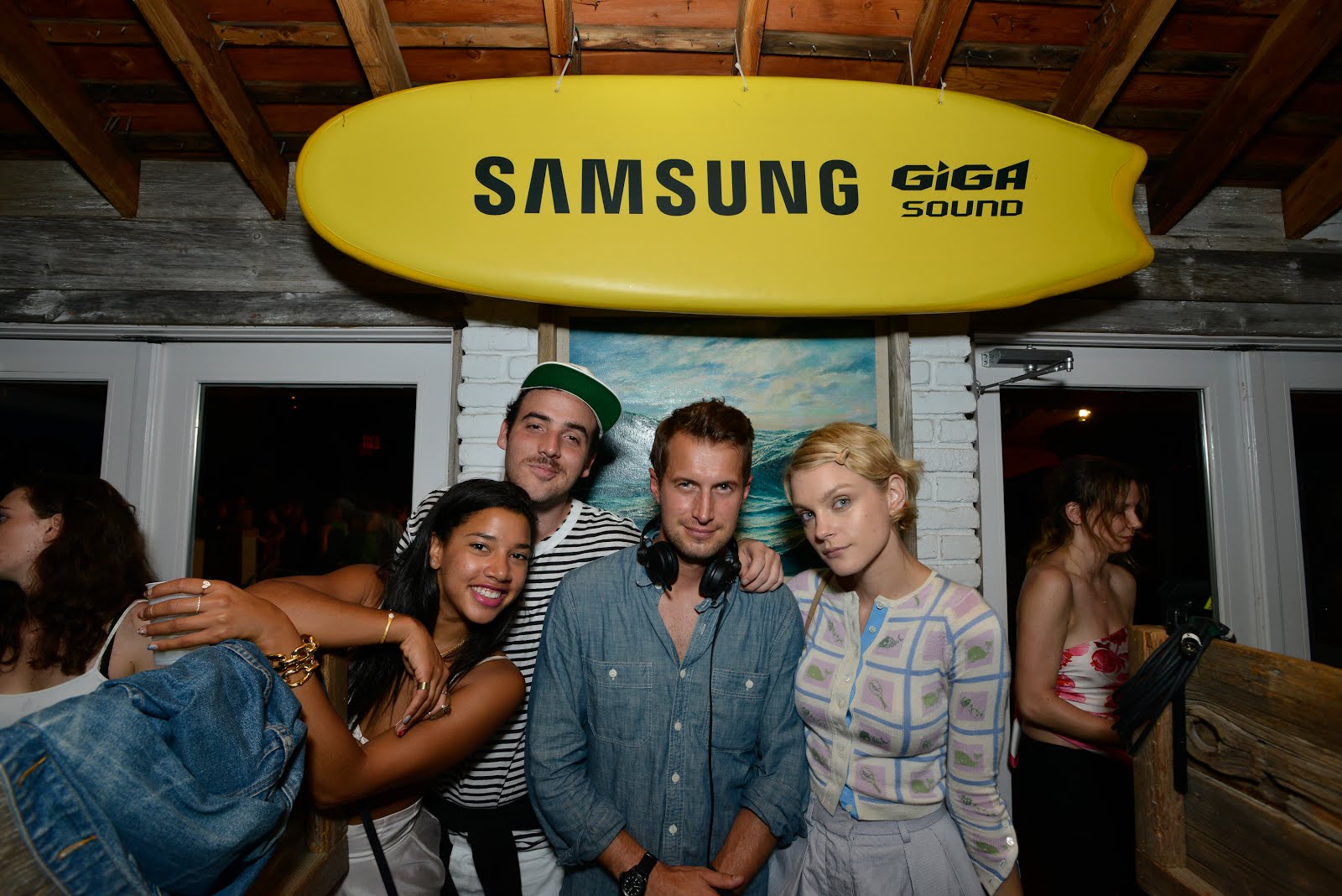 Hannah Bronfman and beau, Brendan Fallis, in the DJ booth showing model, Jessica Stam