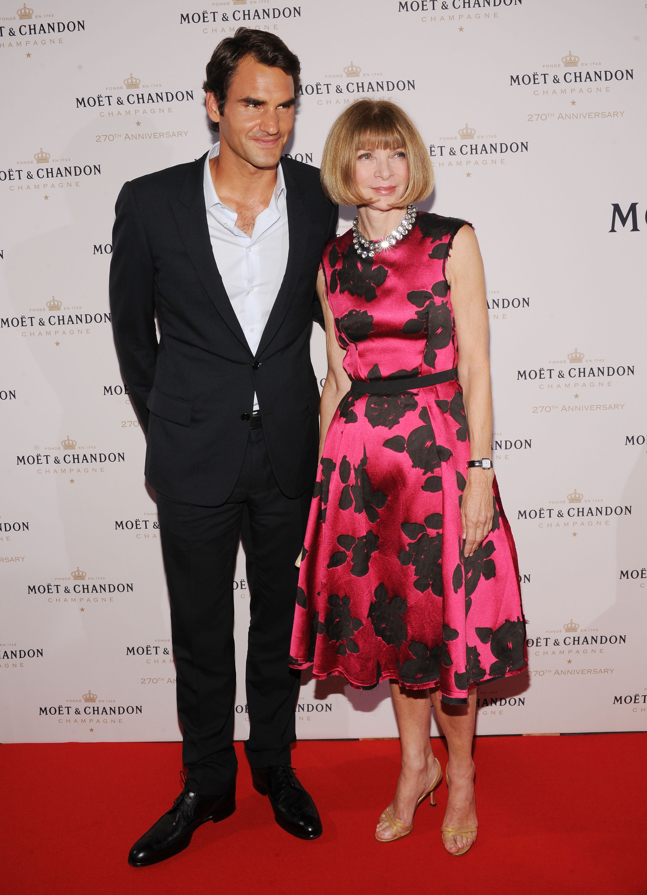 NEW YORK, NY - AUGUST 20:  Professional Tennis Player Roger Federer (L) and Vogue Editor-in-Chief Anna Wintour attend Moet & Chandon Celebrates Its 270th Anniversary With New Global Brand Ambassador, International Tennis Champion, Roger Federer at Chelsea Piers Sports Center on August 20, 2013 in New York City.  (Photo by Bryan Bedder/Getty Images for Moet & Chandon)