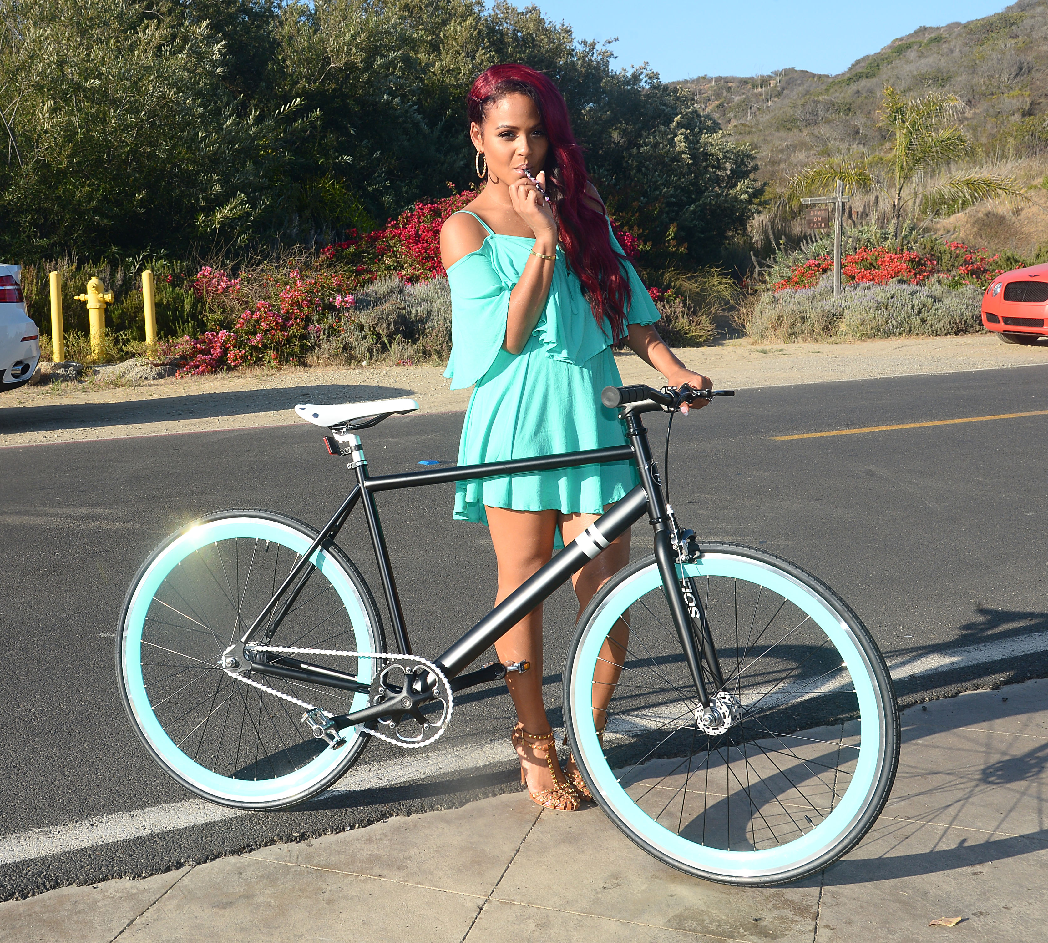 Christina Milian Rides a Sole Bicycle at the Revolve Beach House on August 3, 2013, Los Angeles, California USA. Photo Credit Brian Lindensmith. Copyright All Access Photo Agency.