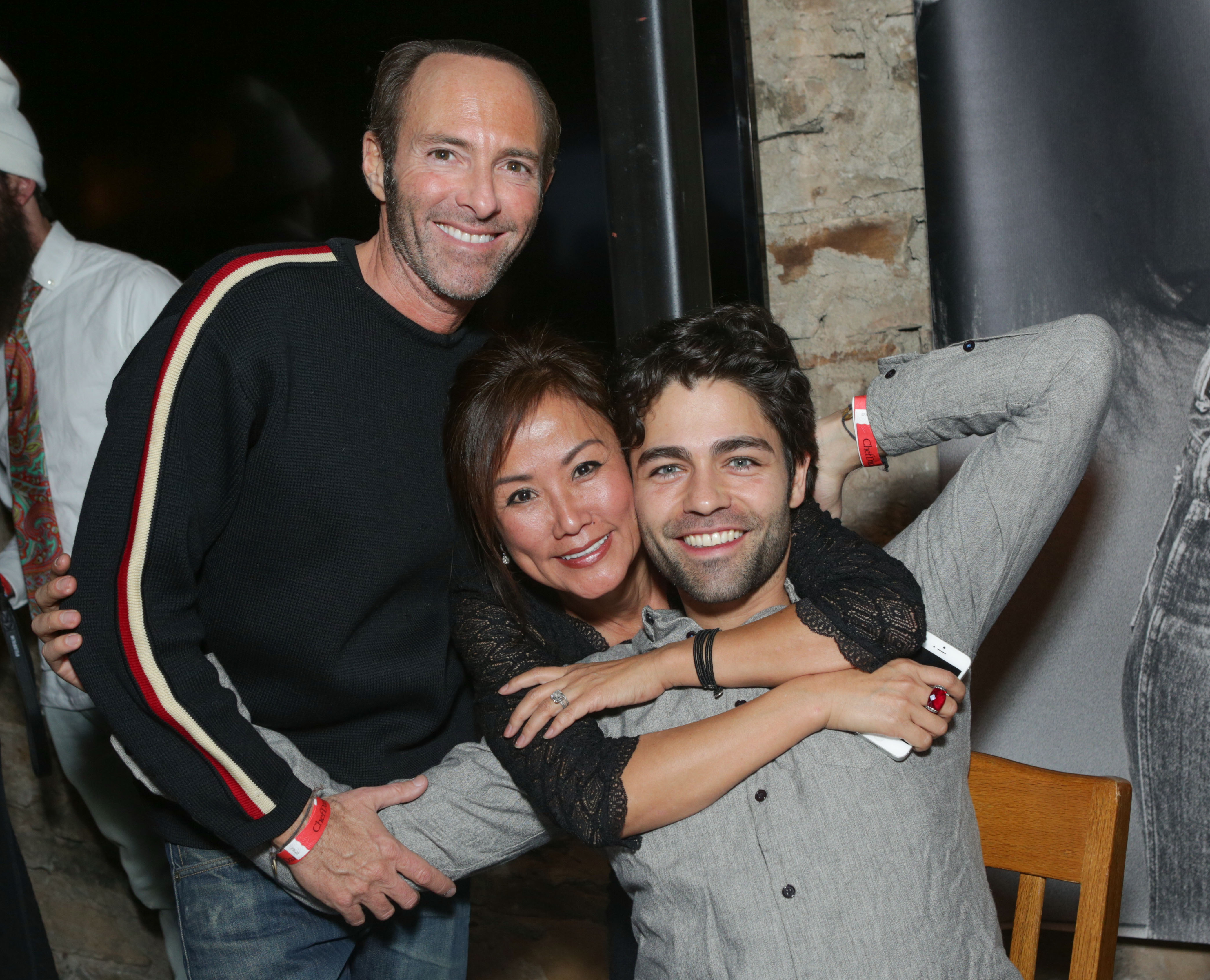 PARK CITY, UT - JANUARY 20: Producer Peter Glatzer, founder of ChefDance Mimi Kim and actor Adrian Grenier attend ChefDance Sponsored by SUJA Juices, El Tesoro Tequila & Sunrider on January 20, 2014 in Park City, Utah.  (Photo by Tiffany Rose/Getty Images for ChefDance)
