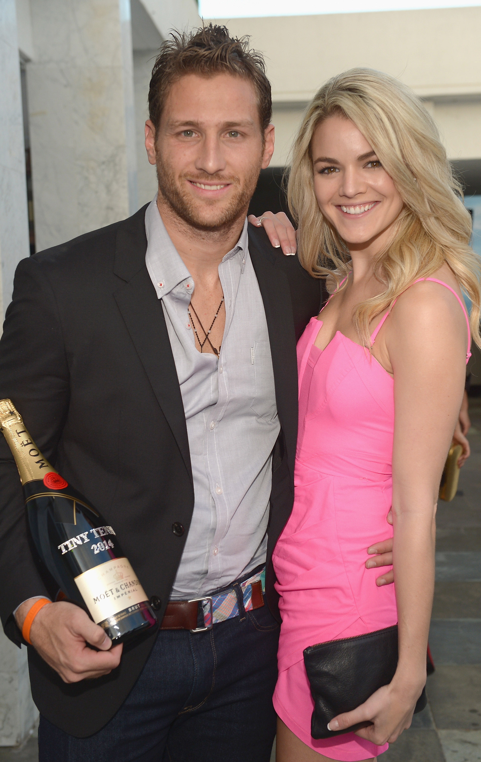 Juan Pablo Galavis and Nikki Ferrell attends the Moet & Chandon "Tiny Tennis" With Roger Federer at Club 50 at Viceroy Miami on March 19, 2014 in Miami, Florida.  (Photo by Gustavo Caballero/Getty Images for Moet & Chandon)