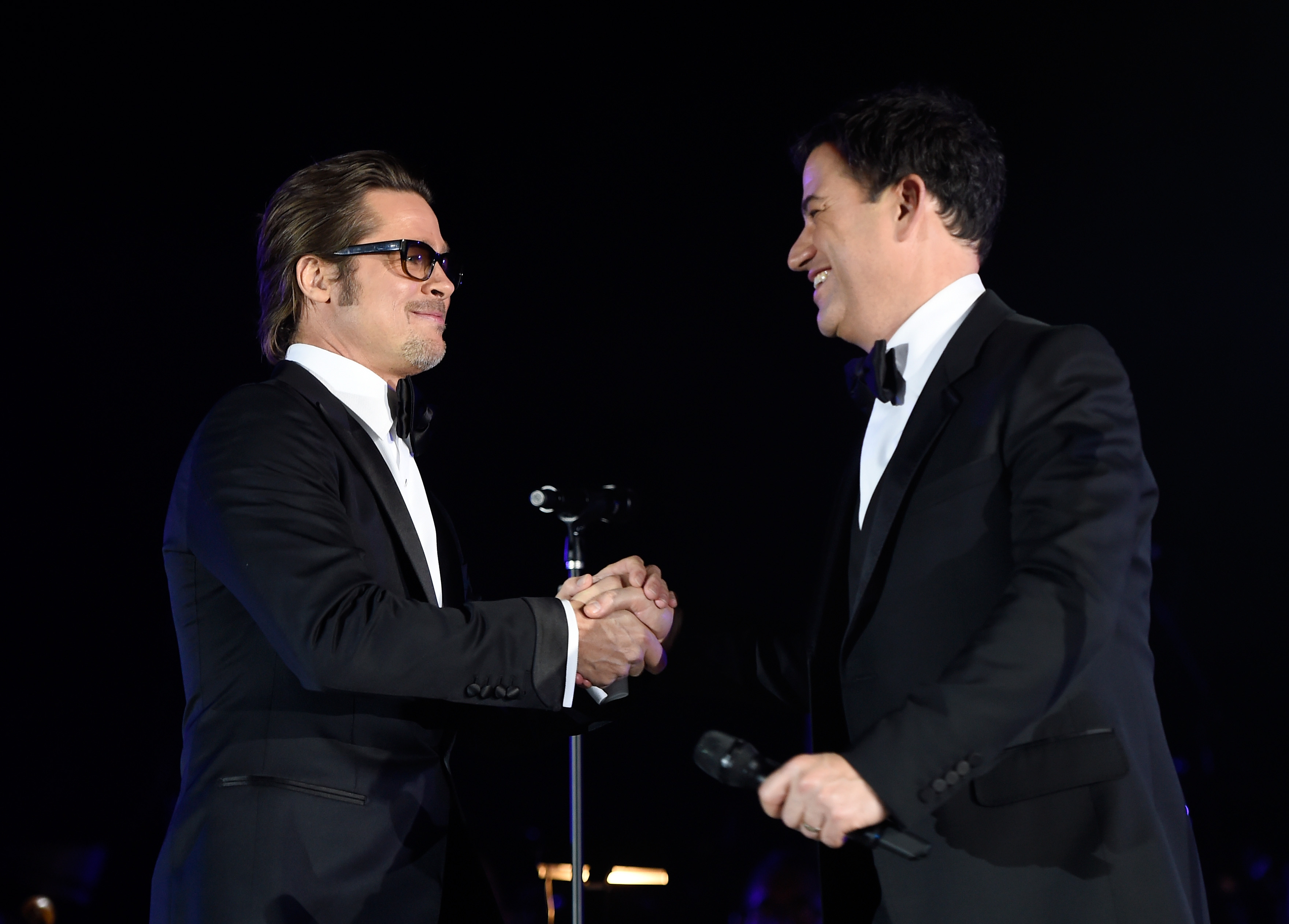 Actor Brad Pitt (L) and host Jimmy Kimmel