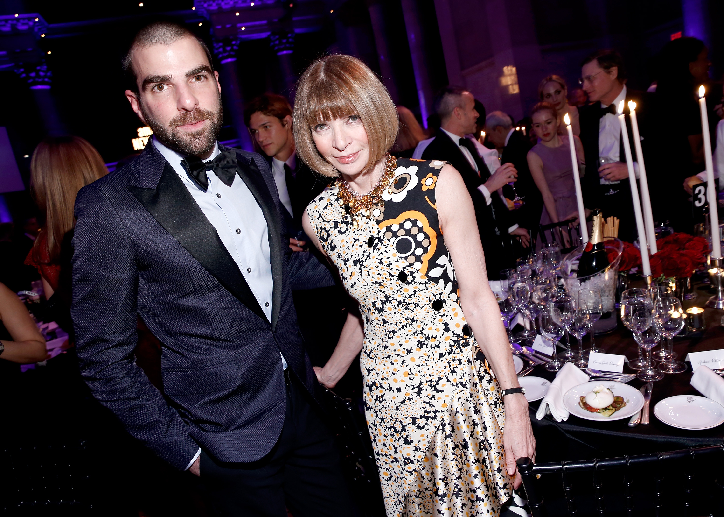 Zachary Quinto (L) and Anna Wintour attend the Moet & Chandon toast to the amfAR Gala at Cipriani Wall Street