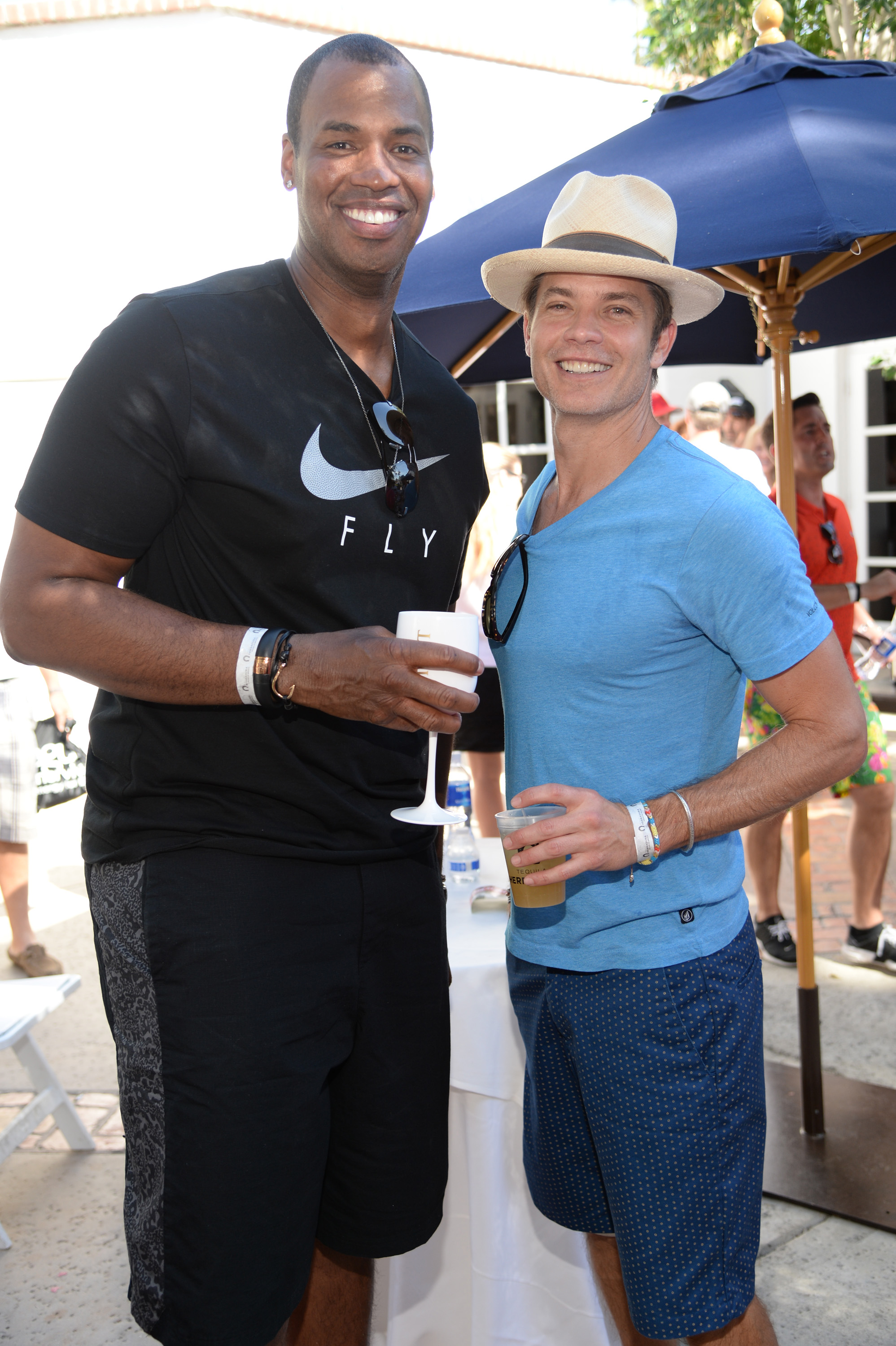 Basketball player Jason Collins and actor Timothy Olyphant celebrate with Moet & Chandon at the 11th annual Desert Smash at La Quinta Resort and Club