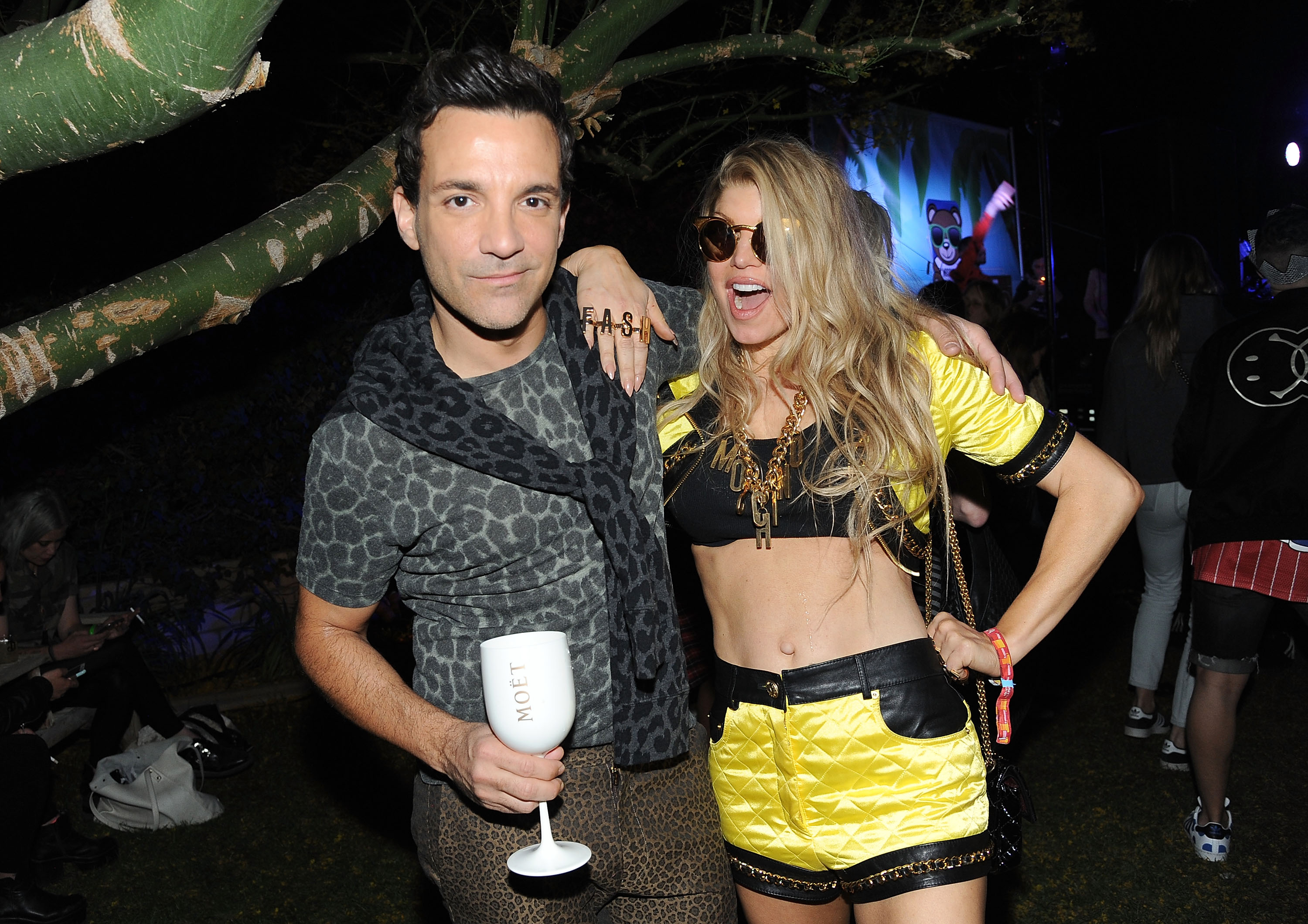 George Kotsiopoulos and singer Fergie enjoying Moet Ice Imperial at Moschino's Late Night hosted by Jeremy Scott at Coachella 2015