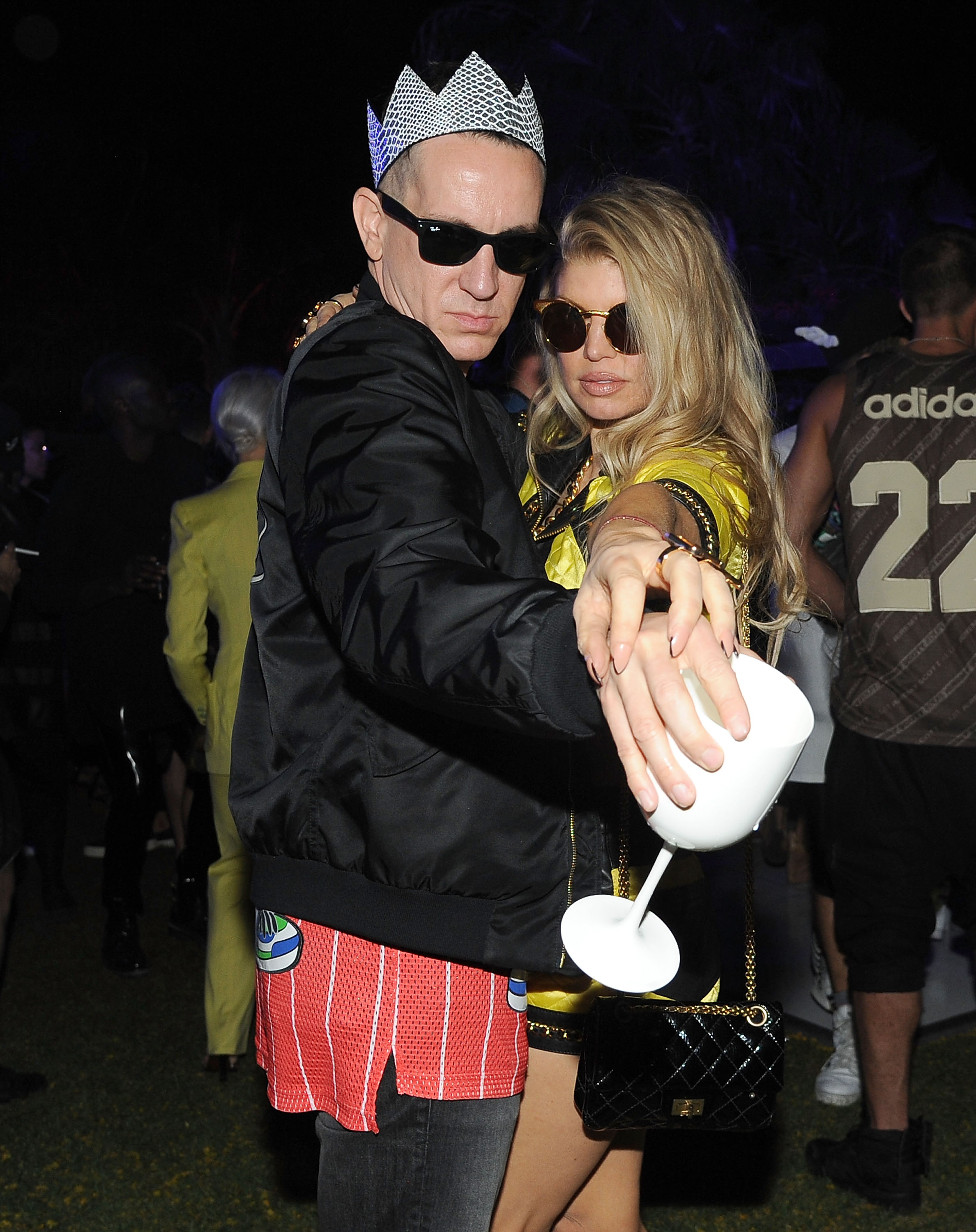Fashion designer Jeremy Scott and singer Fergie enjoying Moet Ice Imperial at Moschino's Late Night hosted by Jeremy Scott at Coachella 2015