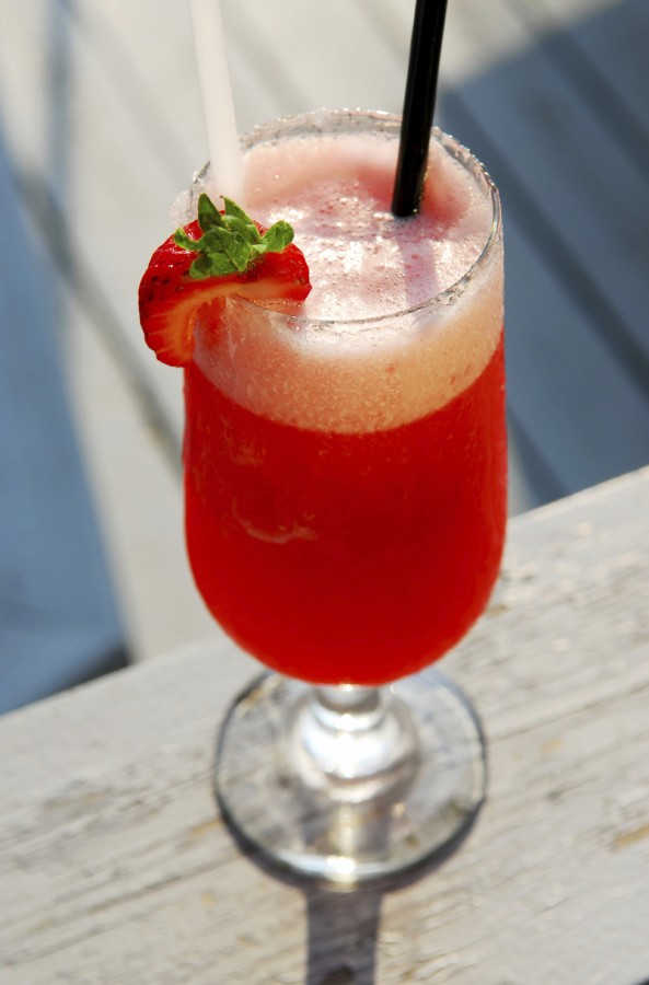Strawberry daiquiri cocktail served in a cold glass outdoor