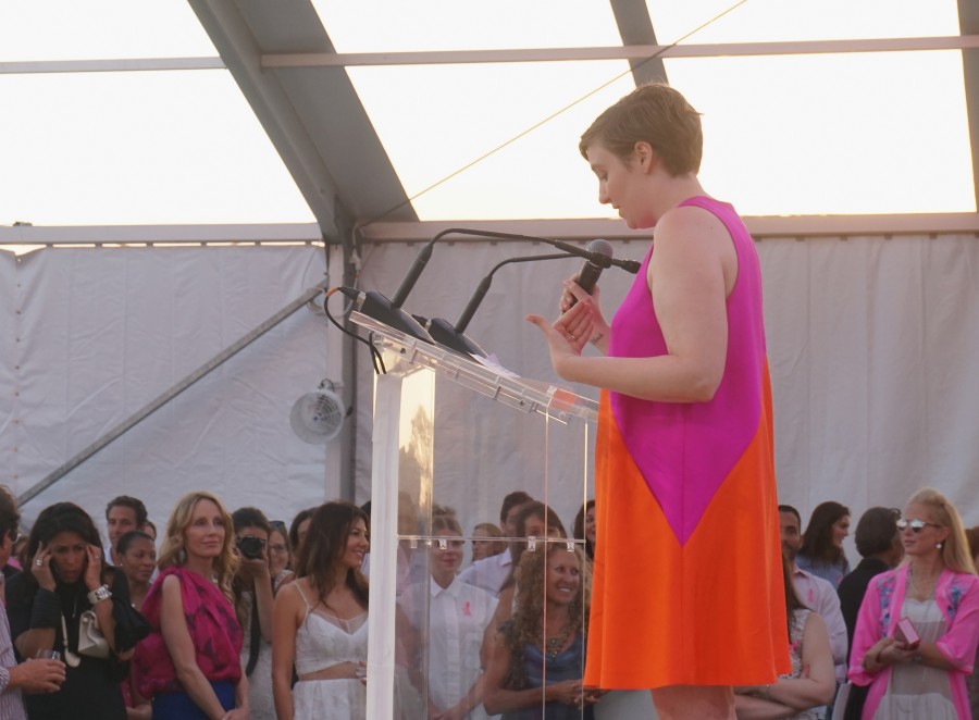 BRIDGEHAMPTON, NY - AUGUST 01:  Lena Dunham toasts to Paddle for Pink with Moet Ice Imperial on August 1, 2015 in Bridgehampton, New York.  (Photo by Steven Henry/Getty Images for Moet & Chandon)