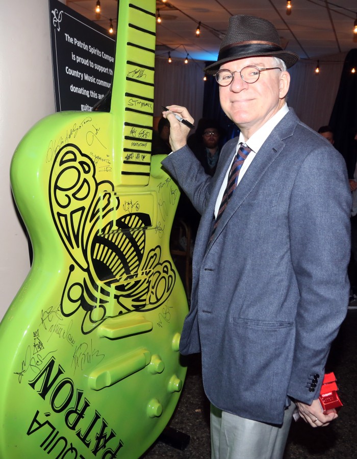 Steve Martin sings the Patron Guitar backstage at the CMA Awards 11/04/2015.