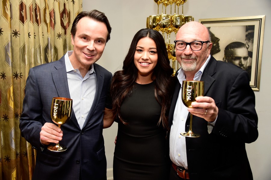 LOS ANGELES, CA - DECEMBER 08: Vice President of Moet & Chandon at Moet Hennessy USA Thomas Bouleuc and 2015 Golden Globe winner Gina Rodriguez and President of The Hollywood Forgien Press Lorenzo Soria celebrate Moets 25th Anniversary at the Golden Globes with the launch of The Moet Moment Film Festival Competition at the Chateau Marmont in Los Angeles on December 8, 2015 in Los Angeles, California. (Photo by Frazer Harrison/Getty Images for Moet & Chandon)