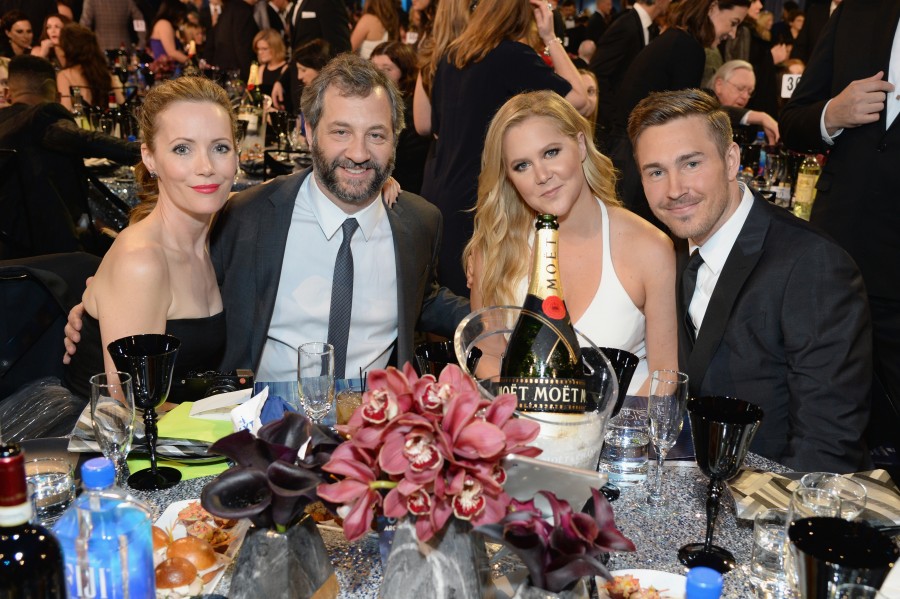SANTA MONICA, CA - JANUARY 17: (L-R) Actress Leslie Mann, director/producer Judd Apatow, honoree Amy Schumer, and designer Ben Hanisch attend the 21st Annual Critics' Choice Awards at Barker Hangar on January 17, 2016 in Santa Monica, California. (Photo by Michael Kovac/Getty Images for Moet & Chandon)