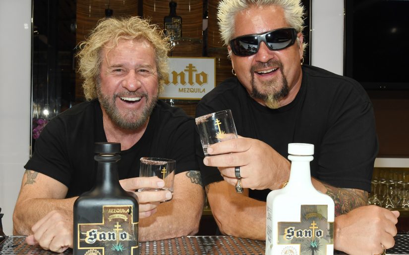 LAS VEGAS, NEVADA - APRIL 04:  Rock & Roll Hall of Fame inductee Sammy Hagar (L) and Emmy Award-winning chef and television personality Guy Fieri pose during the announcement of their partnership with Los Santo and Santo Puro Mezquila, in addition to the launch of Santo Fino Tequila at Southern Glazer's Wine & Spirits on April 4, 2019 in Las Vegas, Nevada.  (Photo by Ethan Miller/Getty Images for Los Santos: Santo Puro Mezquila)