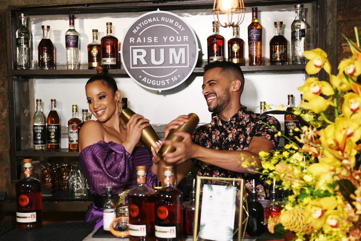 NEW YORK, NEW YORK - AUGUST 16: Dascha Polanco and Darnell Holguin create a specialty cocktail as BACARDI celebrates National Rum Day on August 16, 2019 in New York City. (Photo by Noam Galai/Getty Images for BACARDI)